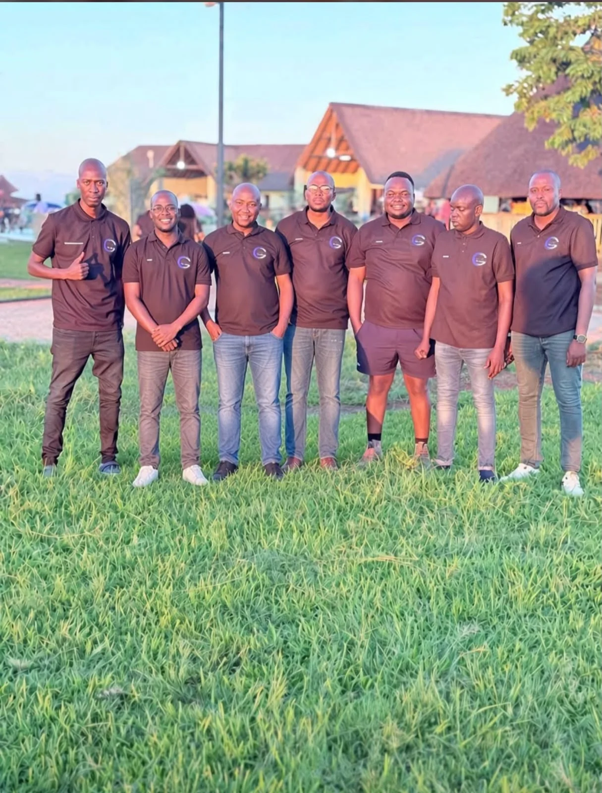 Members of a community savings group standing together with their hands joined